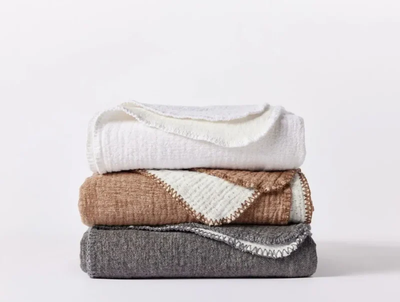 pdp cozy cotton throw stack multicolor sp23 09267 2ae16881 b3fb 4bec b12b 75bc17ad19a0.webp
